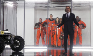 (Various) At the Kennedy Space Center, Nathaniel Shepherd (Gary Oldman) gives a speech and introduces the Magellan-61 astronauts