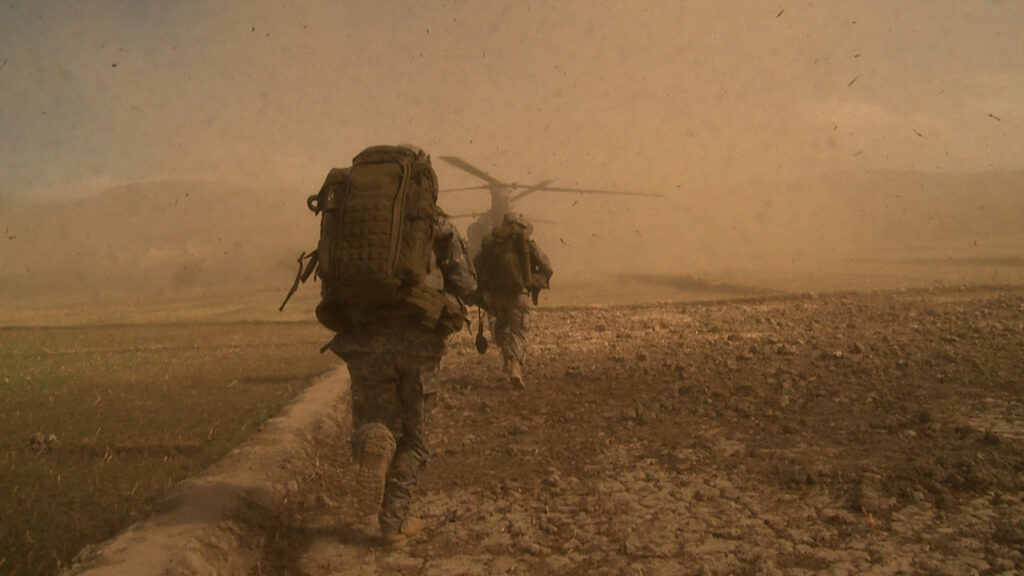 A soldier runs in a still from Interpreters Wanted
