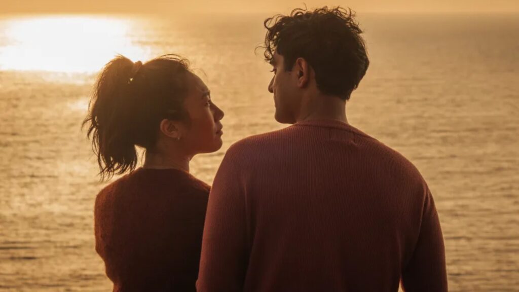 A man and a woman stare at each other in a still from the film Paper Flowers