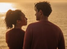 A man and a woman stare at each other in a still from the film Paper Flowers