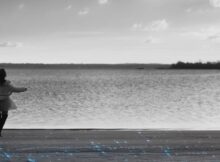 a woman dances on a beach in the film nyctophobia