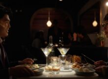 two Asian men have dinner together in the film Anywhere the Wind Blows