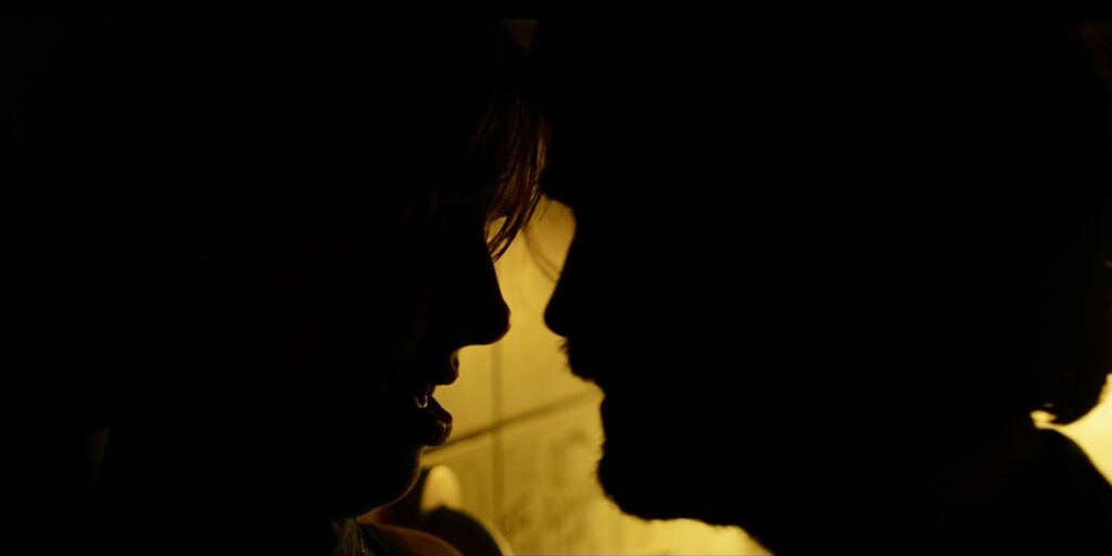 a man and a woman embracing in a still from the short film get you better