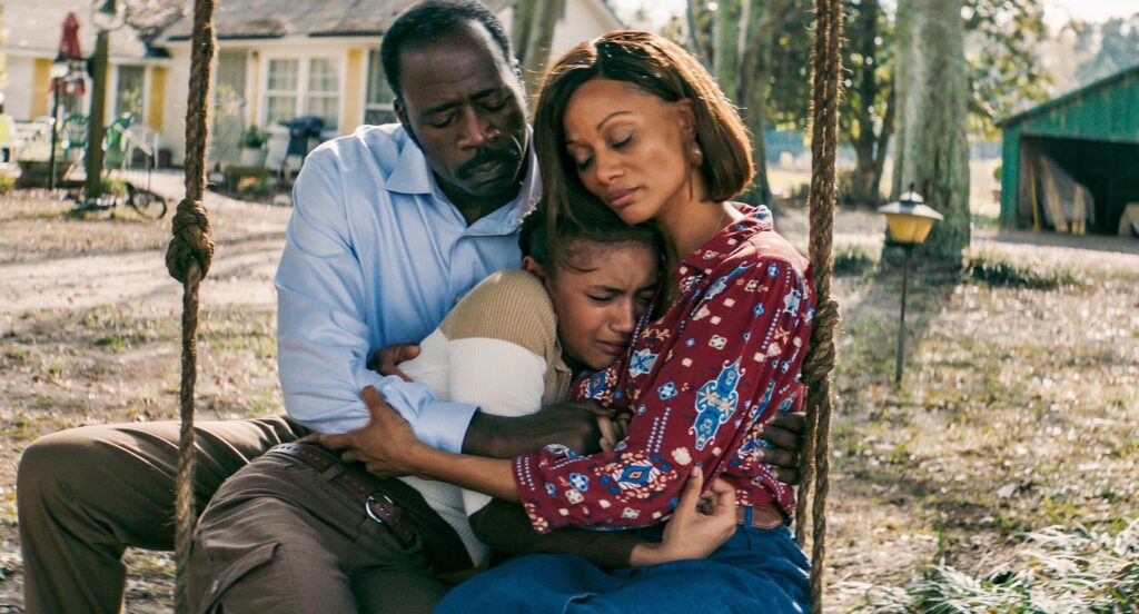 a family in an embrace in the film sound of hope