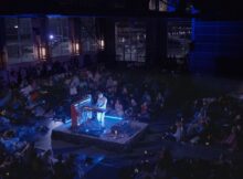 the image of a square-shaped concert hall with an artist in the center in the film music for mushrooms