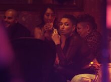 A woman having a smoke in the film The Low End Theory