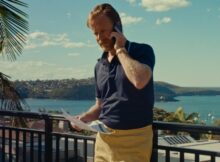 a man speaks on the phone in the film the big dog