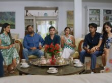 a family drinking tea in the film curry scent