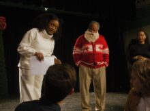 the director of a school play leads the actors in mr santa a christmas extravaganza