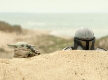 Grogu and Din Djarin during a stakeout in a scene from ‘The Mandalorian and Grogu’.