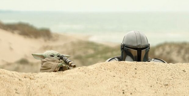 Grogu and Din Djarin during a stakeout in a scene from ‘The Mandalorian and Grogu’.