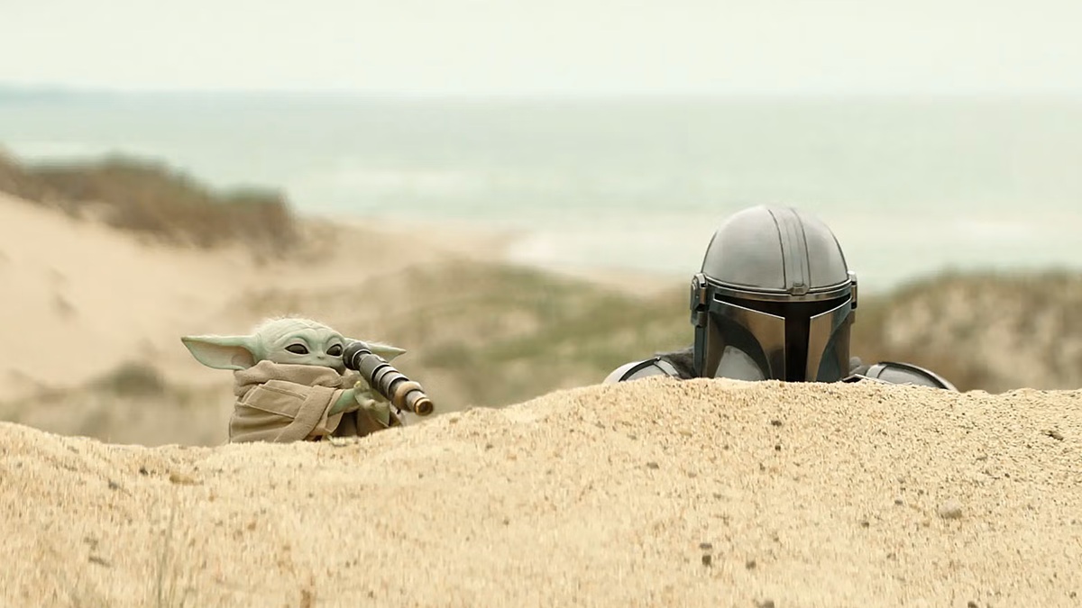 Grogu and Din Djarin during a stakeout in a scene from ‘The Mandalorian and Grogu’.
