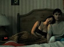 Nikki (Inde Navarrette) and Bear (Michael Johnston) in bed.